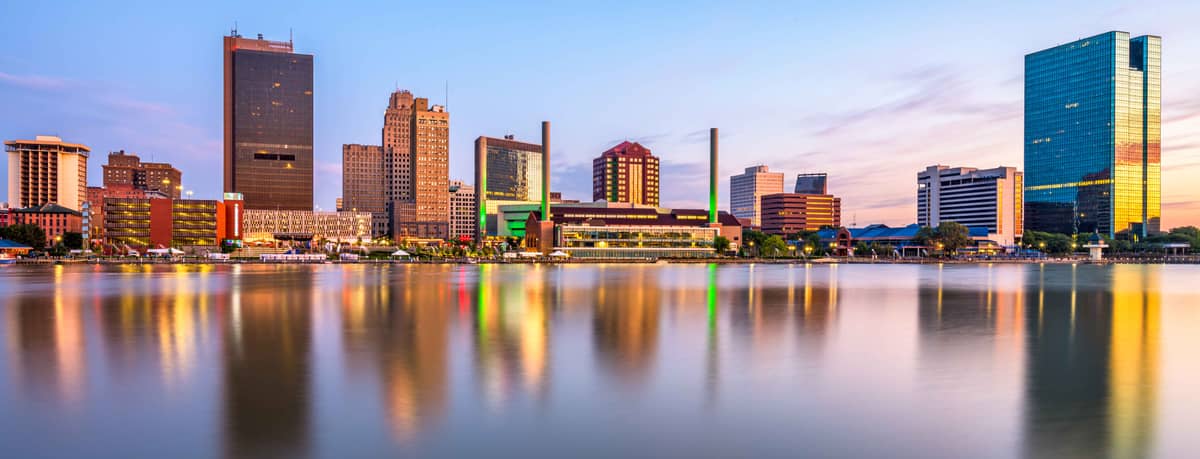 The downtown Toledo, Ohio skyline reflected in the Maumee River at dusk